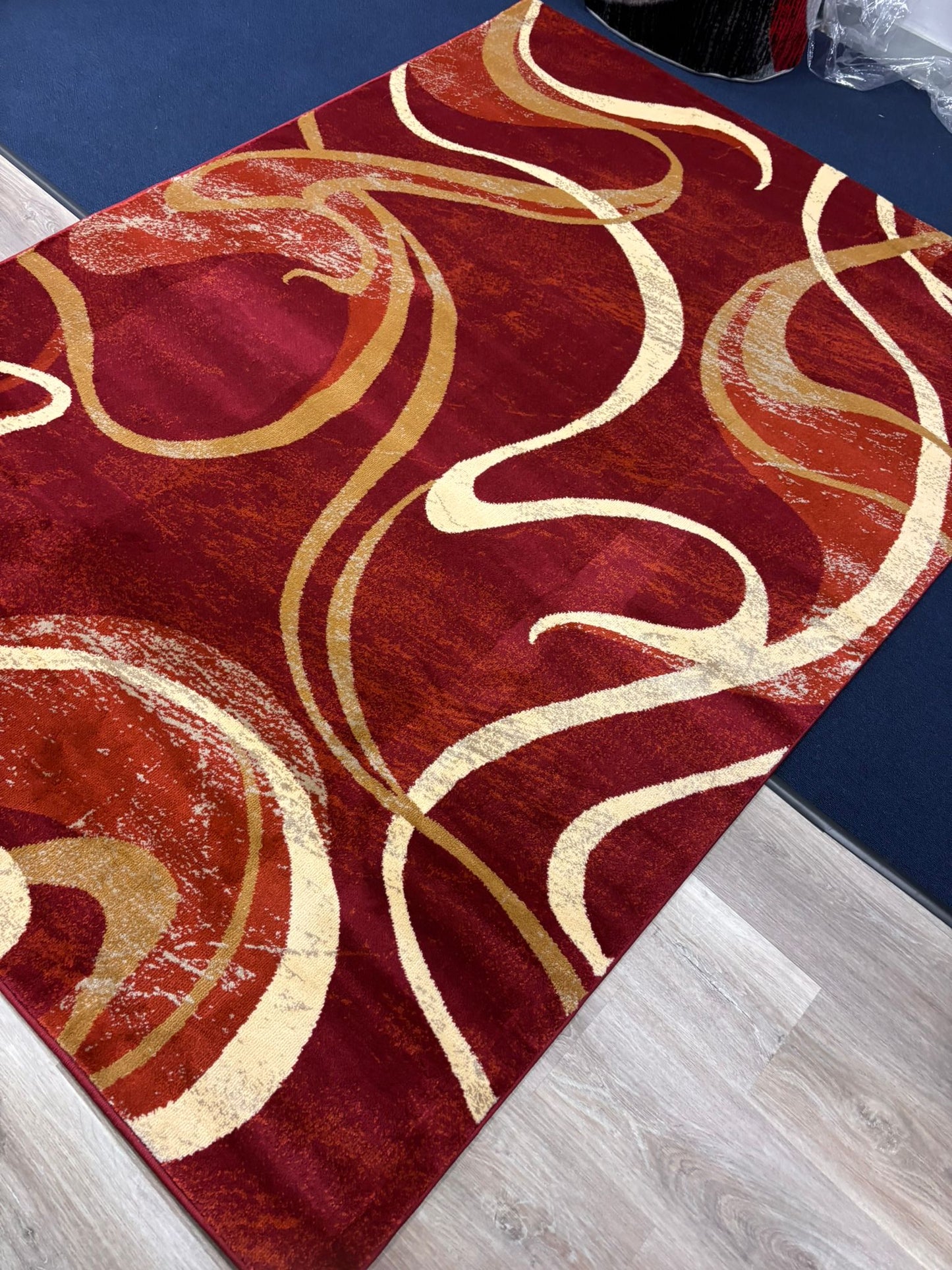 Red Abstract Swirl Area Rug – Modern Curvy Pattern in Gold & Cream