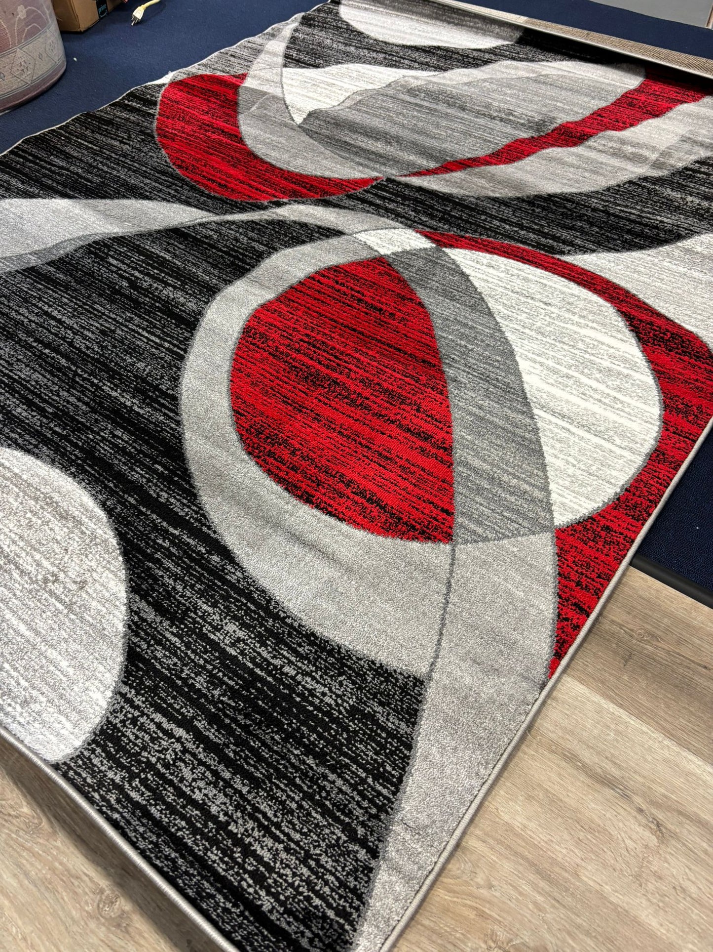 Red & Black Modern Swirl Area Rug – Eye-Catching Abstract Carpet