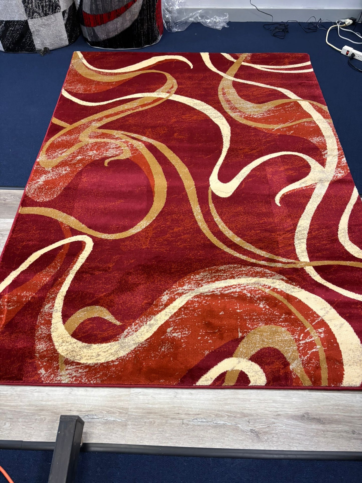 Red Abstract Swirl Area Rug – Modern Curvy Pattern in Gold & Cream
