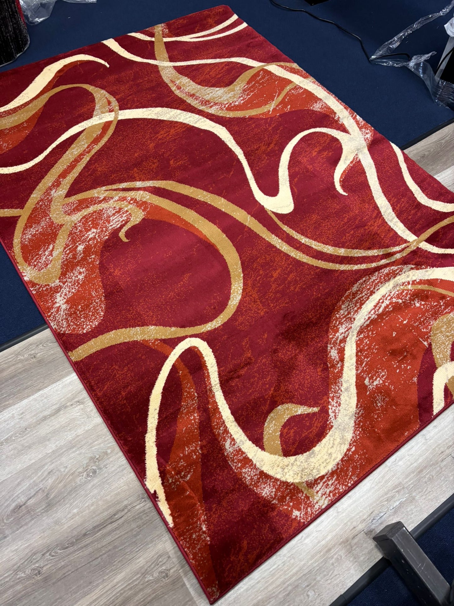 Red Abstract Swirl Area Rug – Modern Curvy Pattern in Gold & Cream